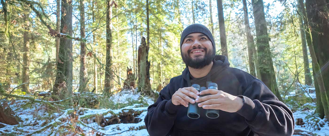 Man hiking and wearing Schel hoodie